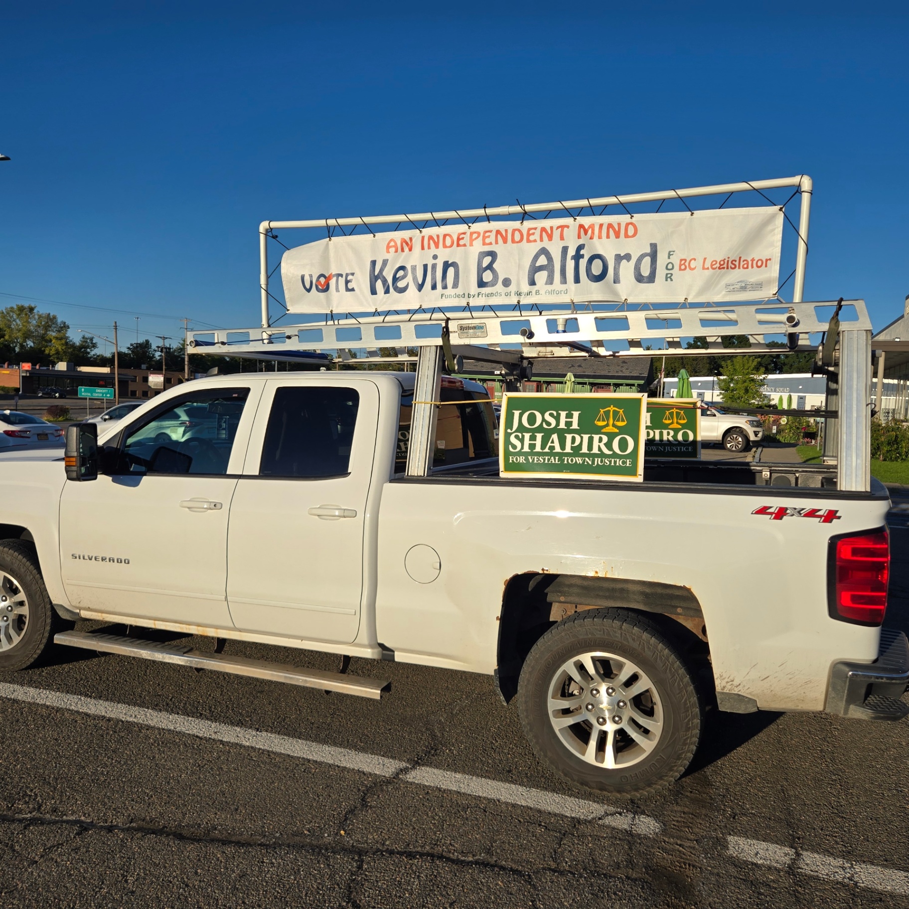 The campaign truck with its banner at a local event